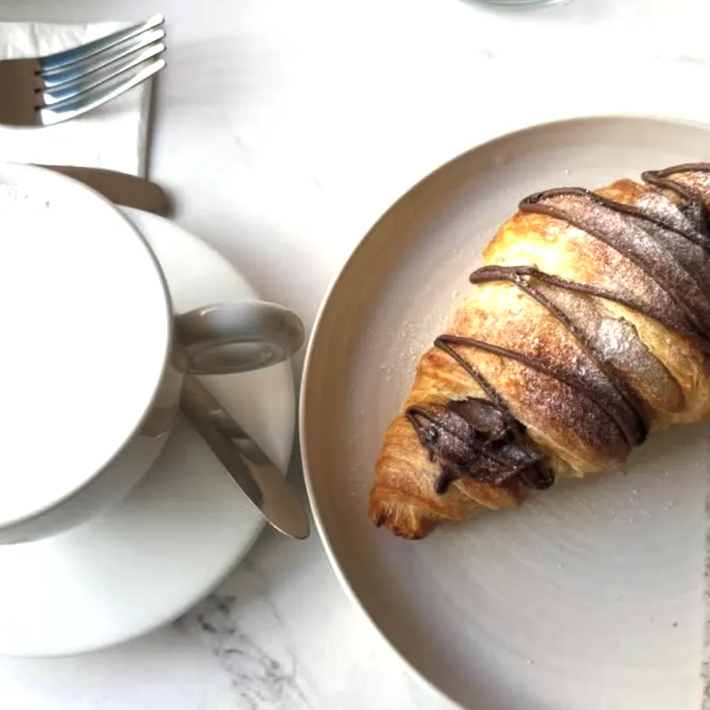Chocolate croissant with coffee